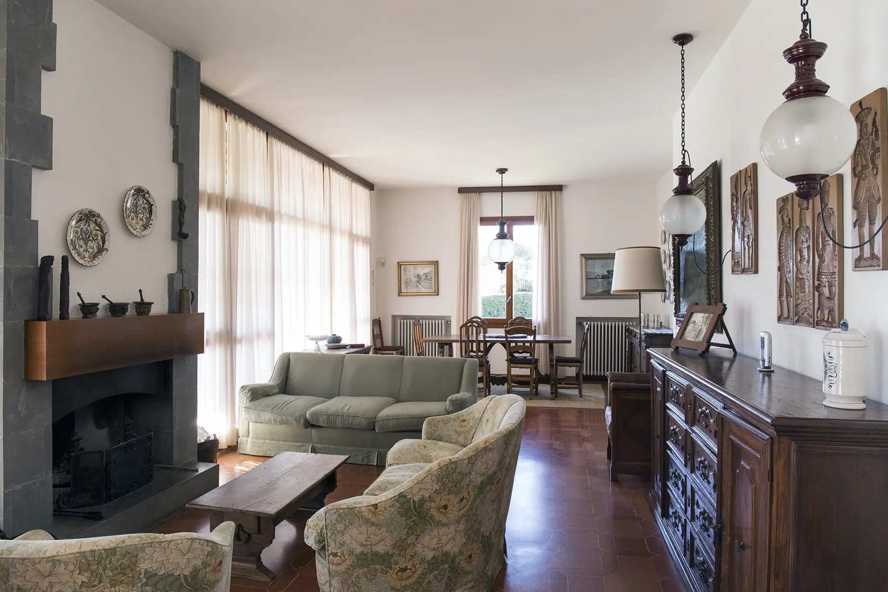 Living room with window walls and fireplace